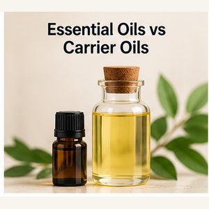 Essential oil bottle beside a carrier oil bottle